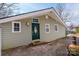 Home exterior shows siding and front entry with porch light and updated green front door at 4846 Midway Sand Rd, Hickory, NC 28601