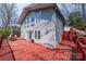 Rear exterior of a home with a wooden deck, many windows, and lake views at 4846 Midway Sand Rd, Hickory, NC 28601