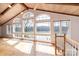 Spacious living room featuring large windows offering stunning water views and filling the space with natural light at 4846 Midway Sand Rd, Hickory, NC 28601