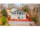 Large back deck with stairs, large windows, and back exterior of the house at 4846 Midway Sand Rd, Hickory, NC 28601