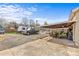 Backyard with a covered patio, parked RV and truck, offering ample space for recreation at 5140 Old Monroe Rd, Indian Trail, NC 28079