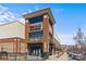 Exterior view of a commercial building showcasing diverse retail stores with brick facade and ample parking spaces at 5140 Old Monroe Rd, Indian Trail, NC 28079