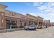 Commercial storefronts with brick facade, awnings, street parking, and clear signage for diverse retail options at 5140 Old Monroe Rd, Indian Trail, NC 28079