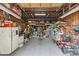 Inside the garage with lawn equipment, tools, and storage shelves at 5140 Old Monroe Rd, Indian Trail, NC 28079