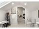 Bright bathroom boasts white marble floors, modern fixtures, and ladder-style shelving next to the toilet at 5217 Camilla Dr, Charlotte, NC 28226