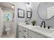 Bathroom with double sinks, modern fixtures, and decorative mirrors offers plenty of counter space at 5217 Camilla Dr, Charlotte, NC 28226