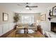 Bright living room featuring a white painted brick fireplace, a bay window, and neutral decor at 5217 Camilla Dr, Charlotte, NC 28226