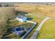 Aerial view showcases the home's proximity to farmland with an in-ground pool, deck, and gazebo at 5413 Austin Rd # 4, Monroe, NC 28112