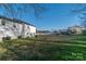 Large backyard featuring a lawn, a white home exterior, and a pool in the distance at 5413 Austin Rd # 4, Monroe, NC 28112