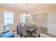 Inviting dining room showcasing a stylish chandelier, large windows, and a decorative table setting at 5413 Austin Rd # 4, Monroe, NC 28112