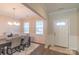 Elegant dining area featuring a modern chandelier, natural light, and neutral color palette at 5413 Austin Rd # 4, Monroe, NC 28112