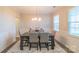 Bright dining area featuring wainscoting, modern lighting, and an open layout at 5413 Austin Rd # 4, Monroe, NC 28112