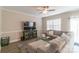 Comfortable living room featuring a large sectional sofa, modern ceiling fan, and a stylish entertainment center at 5413 Austin Rd # 4, Monroe, NC 28112