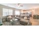 Inviting living room with a large sectional sofa, and an open floor plan to the kitchen at 5413 Austin Rd # 4, Monroe, NC 28112