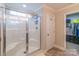 Modern shower with sleek glass doors, built-in shelving, and convenient access to the walk-in closet at 5413 Austin Rd # 4, Monroe, NC 28112