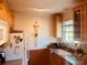 Well-lit kitchen with light wood cabinets and modern appliances at 565 Wakefield Dr, Charlotte, NC 28209