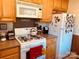 Cozy kitchen with light wood cabinets and granite countertops at 565 Wakefield Dr, Charlotte, NC 28209