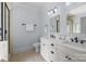 Bathroom featuring a double sink vanity with marble countertop, stylish fixtures, and a glass-enclosed shower at 643 Mcalway Rd, Charlotte, NC 28211