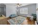 Versatile room featuring hardwood floors, ample natural light, a ceiling fan and generous space for play and study at 643 Mcalway Rd, Charlotte, NC 28211