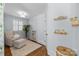 Serene Bedroom with comfortable armchair, shelving and natural light at 643 Mcalway Rd, Charlotte, NC 28211