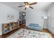 Bedroom with a cozy rug, and ample space for play or relaxation, with a view into the adjacent bedroom at 643 Mcalway Rd, Charlotte, NC 28211