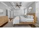 Bright bedroom featuring a decorative ceiling, wood floors, and a large window with charming plantation shutters at 643 Mcalway Rd, Charlotte, NC 28211