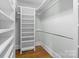 Spacious walk-in closet featuring built-in shelving and hanging rods, perfect for organization and storage at 643 Mcalway Rd, Charlotte, NC 28211