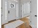 Bright foyer with hardwood floors, decorative wreath on the glass front door, and an adjacent room at 643 Mcalway Rd, Charlotte, NC 28211