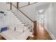 Inviting foyer showcasing the staircase, hardwood flooring, and open layout, with a view of the home's entryway at 643 Mcalway Rd, Charlotte, NC 28211