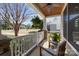 Inviting porch with wood ceiling, comfortable seating, decorative plants and stone column bases at 643 Mcalway Rd, Charlotte, NC 28211