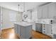 Modern kitchen features white cabinets, countertops, and stainless-steel appliances at 643 Mcalway Rd, Charlotte, NC 28211