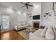 Bright living room with vaulted ceiling, fireplace, and access to the outdoor space at 643 Mcalway Rd, Charlotte, NC 28211