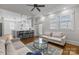 Open-concept living area with a view of the kitchen, featuring hardwood floors at 643 Mcalway Rd, Charlotte, NC 28211