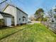 Spacious backyard with a well-manicured lawn, fenced perimeter, and a patio at 7025 Spring Morning Ln, Charlotte, NC 28227