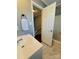 Well-lit bathroom boasts a single vanity, bathtub and updated fixtures at 7025 Spring Morning Ln, Charlotte, NC 28227