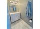 Bright bathroom showcasing modern vanity, mirror, and tile flooring at 7025 Spring Morning Ln, Charlotte, NC 28227