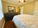 Relaxing bedroom showcasing a dresser and wood-look floors at 7025 Spring Morning Ln, Charlotte, NC 28227