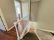 View of the staircase featuring hardwood floors and natural light at 7025 Spring Morning Ln, Charlotte, NC 28227