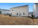 A view of the home's backyard featuring an open grassy area offering plenty of space for recreation at 8010 Bruce St, Charlotte, NC 28215