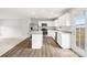 Modern kitchen boasts stainless steel appliances, an island, and white cabinetry at 8010 Bruce St, Charlotte, NC 28215