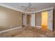 Bedroom with multiple doors, ceiling fan, and ample space at 82 Paddington Sw Dr, Concord, NC 28025