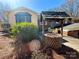 View of outdoor dining space with decorative well adding charm to the backyard at 925 Belmorrow Dr, Charlotte, NC 28214