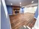 Finished basement area with beautiful floors, brick fireplace and white closet at 925 Belmorrow Dr, Charlotte, NC 28214