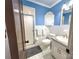 Bathroom with walk-in shower, tiled floor and blue walls at 925 Belmorrow Dr, Charlotte, NC 28214