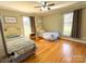 Comfortable bedroom featuring two twin beds, hardwood floors, and natural light at 925 Belmorrow Dr, Charlotte, NC 28214