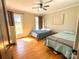 Bedroom with hardwood floors, two beds, and neutral-colored walls at 925 Belmorrow Dr, Charlotte, NC 28214