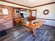 Inviting dining area featuring an elegant wooden table, bar seating, and stylish decor accents at 925 Belmorrow Dr, Charlotte, NC 28214