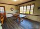 Charming dining room featuring a large window and hardwood-style flooring at 925 Belmorrow Dr, Charlotte, NC 28214