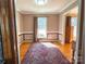 Bright dining room with classic decor, a large window, and hardwood flooring at 925 Belmorrow Dr, Charlotte, NC 28214