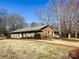 Classic brick house featuring manicured landscaping and a brick pathway at 925 Belmorrow Dr, Charlotte, NC 28214